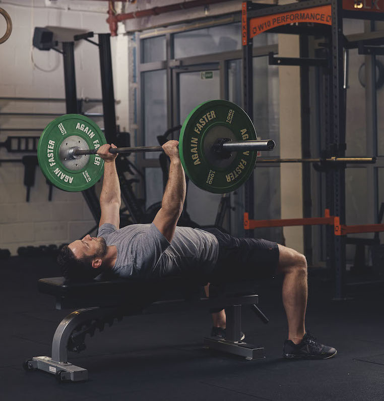 Man demonstrating a Barbell Bench Press