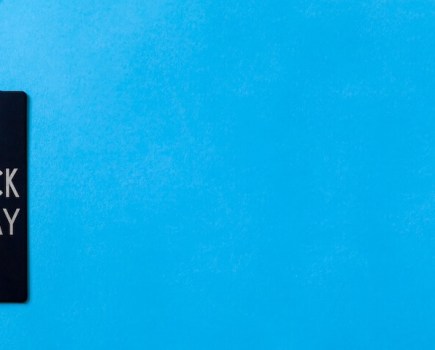 Black Friday shopping tag against blue background