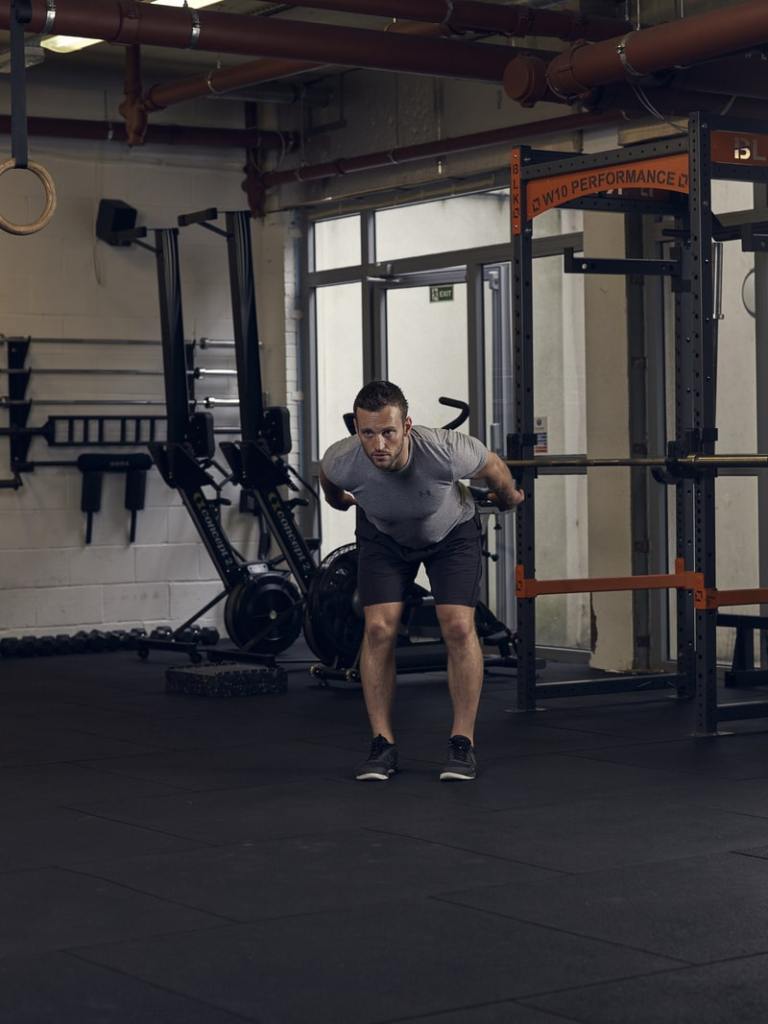 man demonstrates broad jump