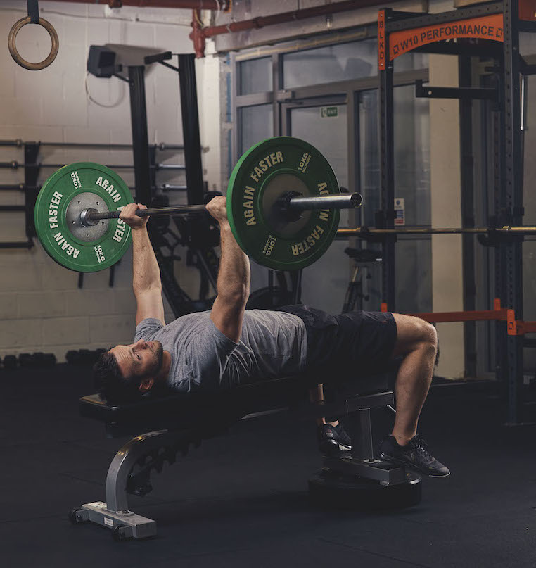 Man demonstrating a Barbell Decline Bench Press 