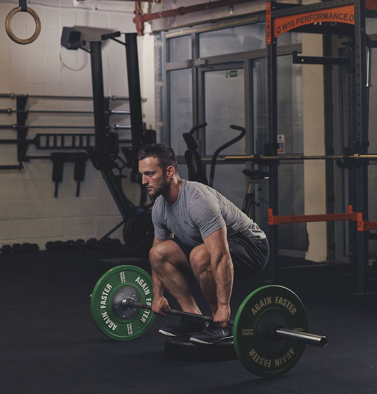 Man demonstrating the Barbell Deficit Deadlift start position