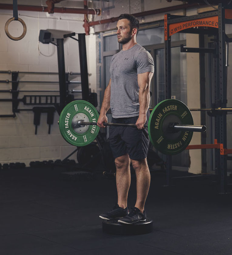 Man demonstrating the Barbell Deficit Deadlift
