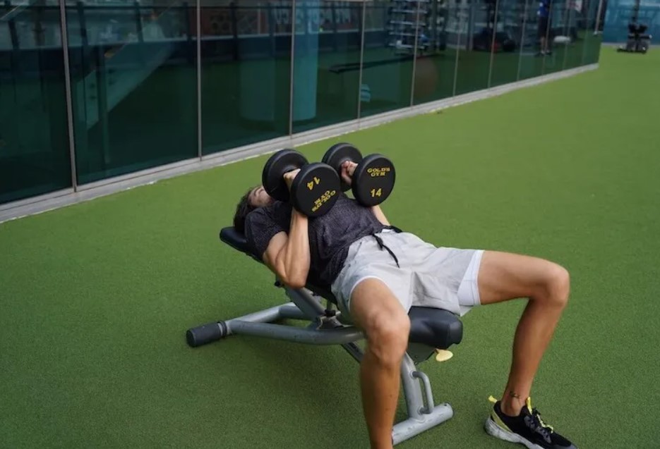Men performing a dumbbell neutral-grip triceps press