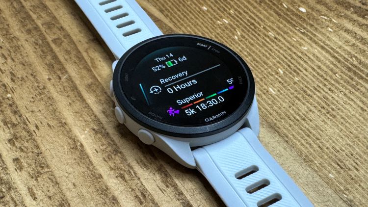 Running watch lying on a table