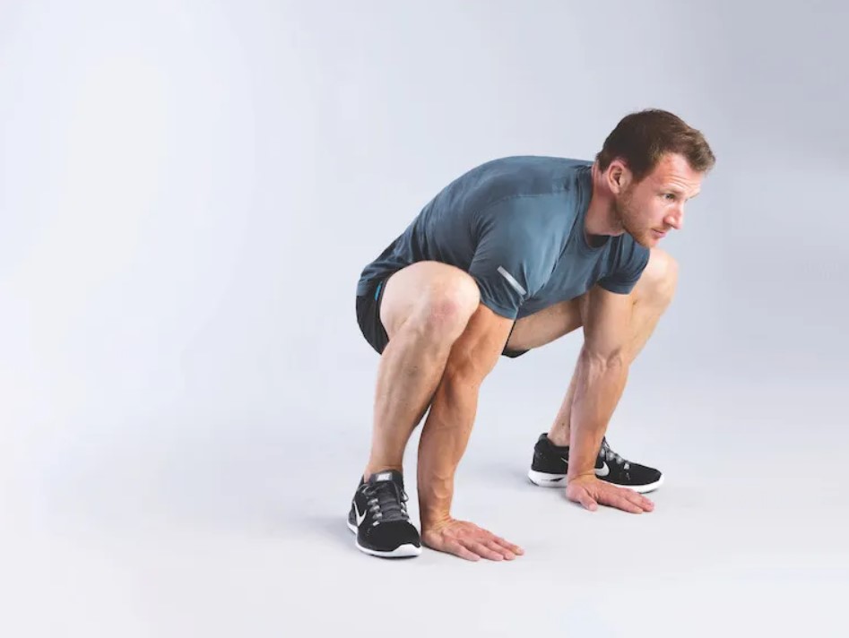 Man performing a groiner stretch