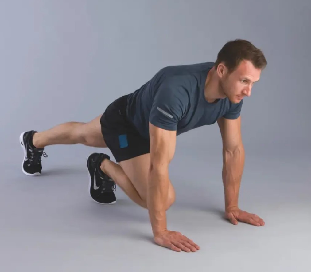 Man performing a mountain climber exercise