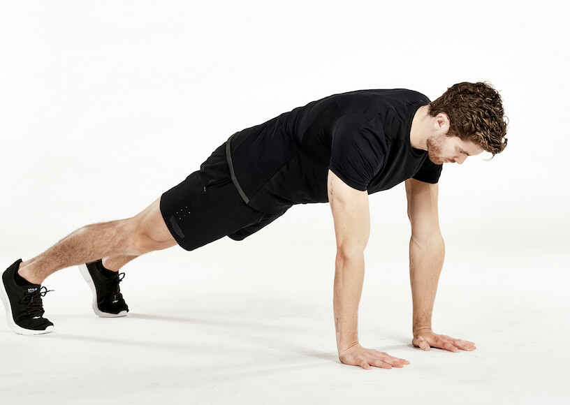 Man performing an extended plank exercise