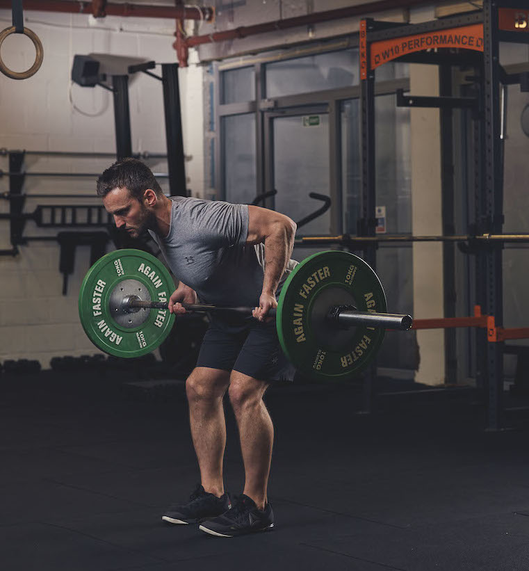 Man demonstrating a Barbell Reverse-Grip Bent-Over Row 