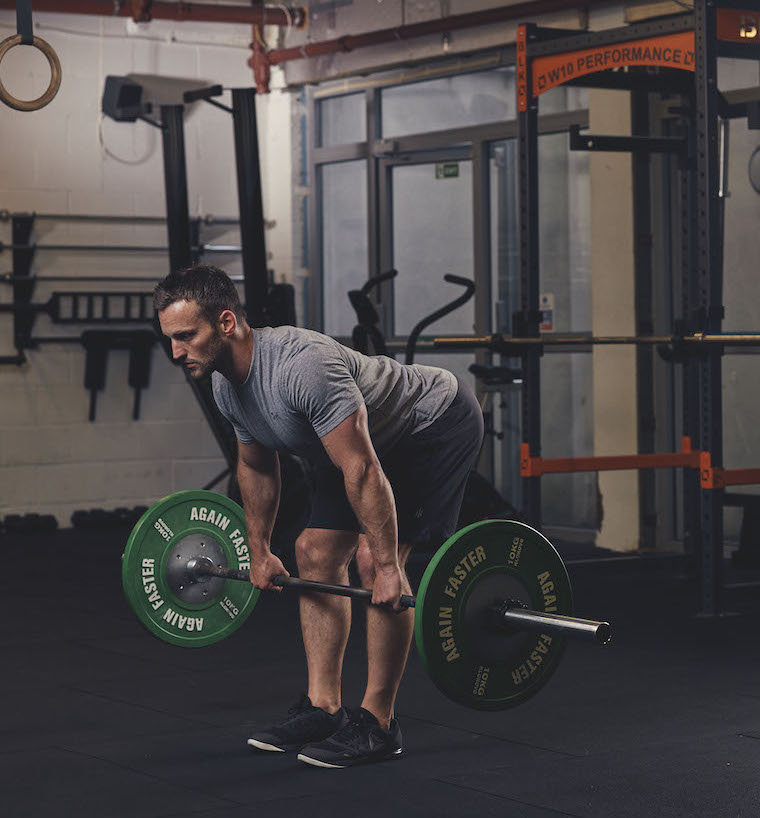 Man demonstrating a Barbell Romanian Deadlift