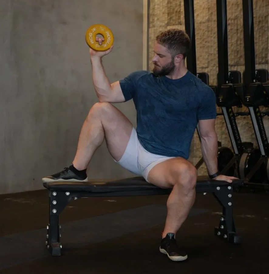 Man performing a seated external rotation