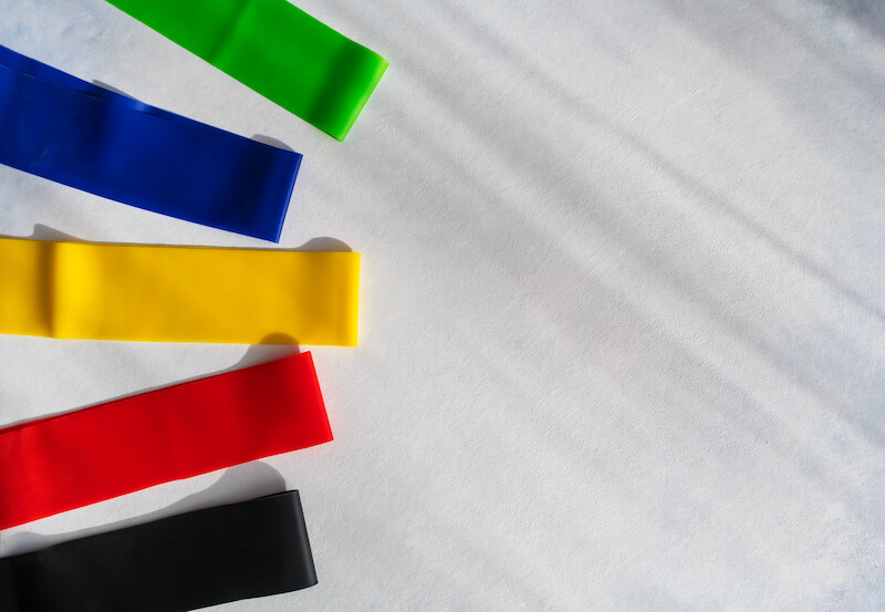 Mini resistance bands lined up on the floor