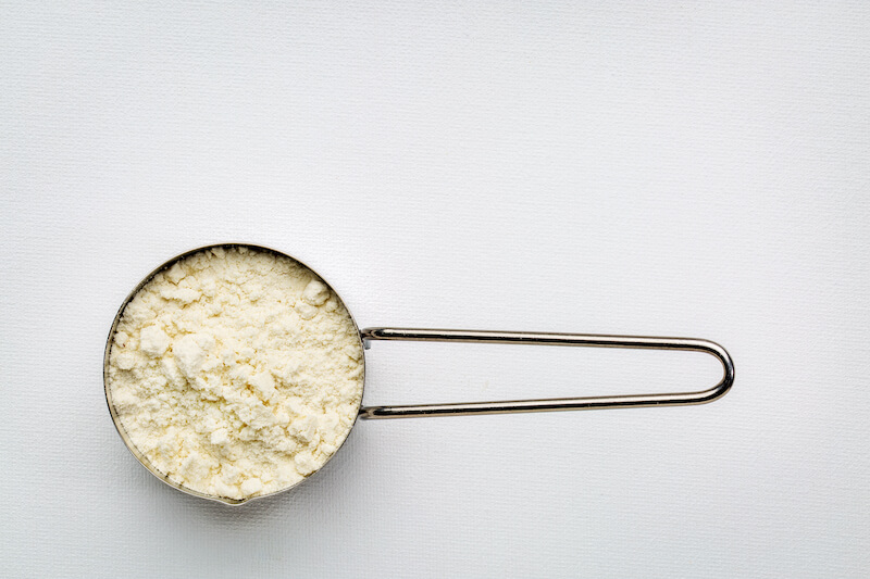 Close up of whey protein powder on scoop