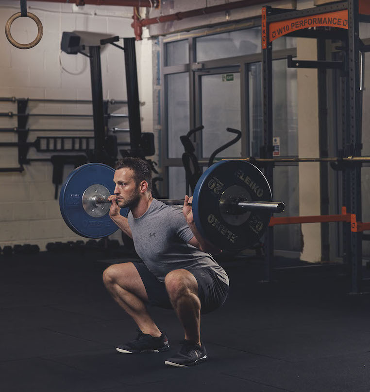 Man demonstrating a Barbell Squat