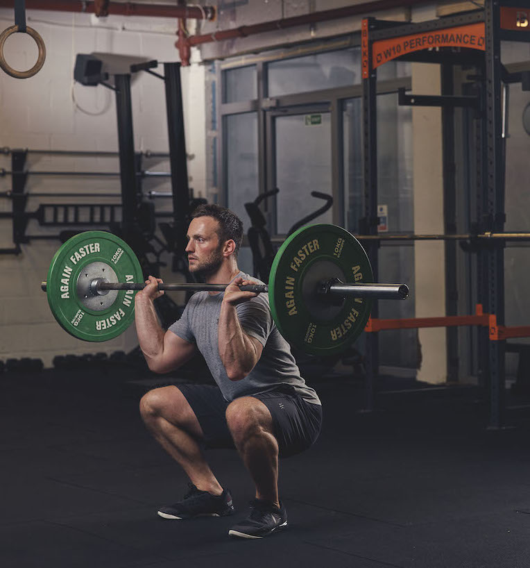 Man demonstrating the Barbell Thruster start position