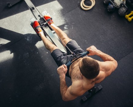 top down view of man on rowing machine