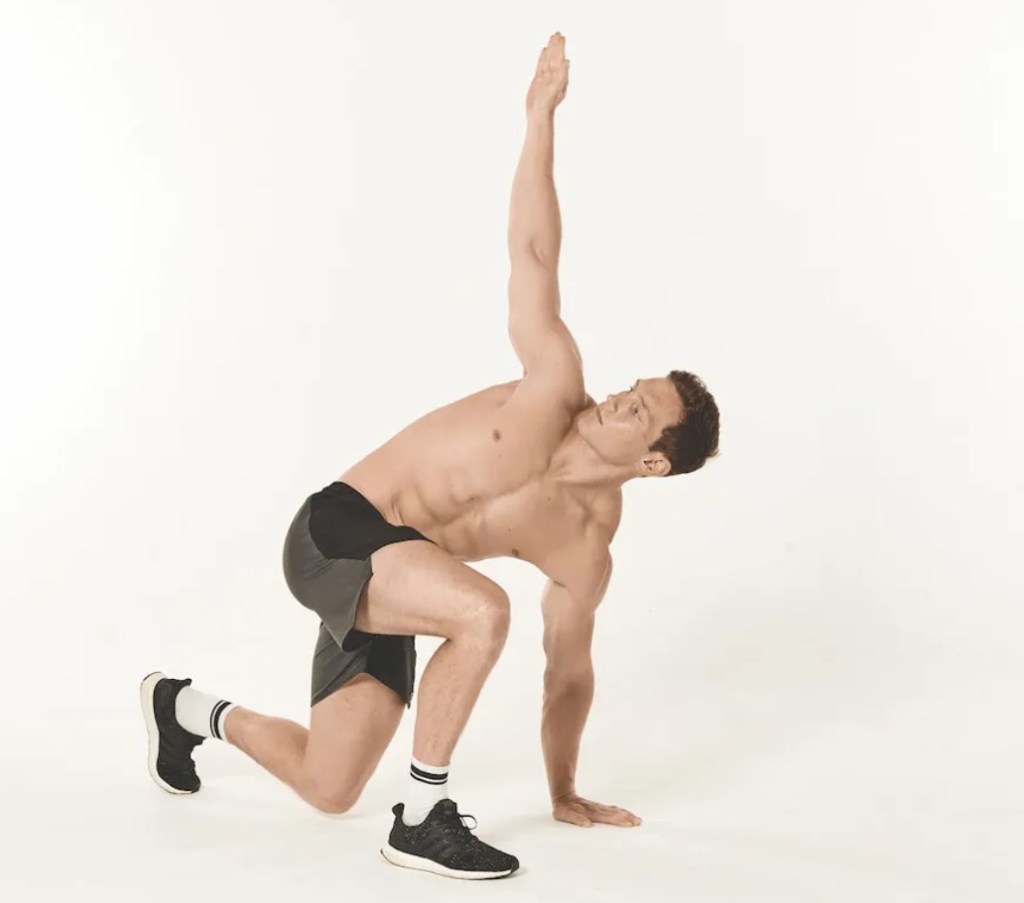 Man performing a kneeling twist